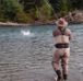 Fly fisherman casting his line into a river